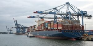 a freight ship with containers, symbolizing international trade