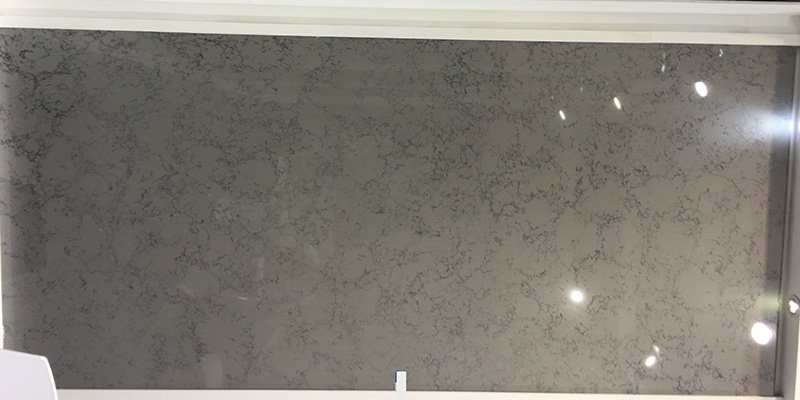 High-Quality Carrara Quartz Surface A close-up of a Carrara quartz slab showing its fine details and flawless polish.