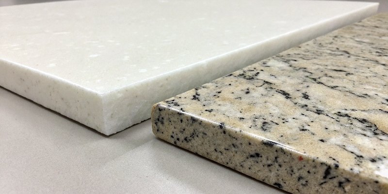 Quartz vs Granite Detail alt text="A close-up of a white quartz slab and a granite slab side by side"