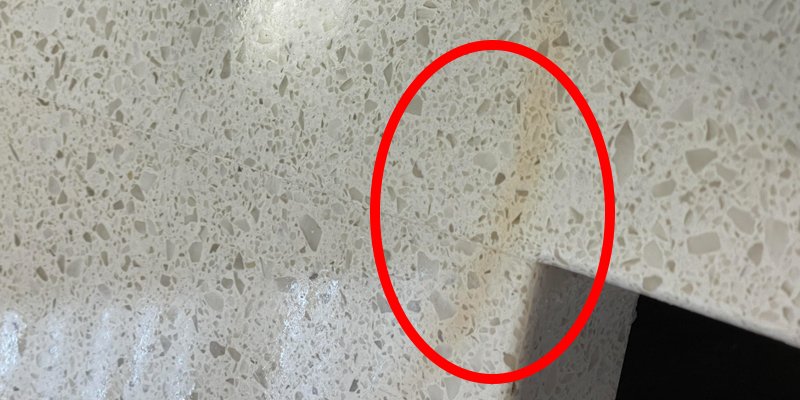 Low-quality quartz slab example a picture of a low-quality quartz slab with visible discoloration and spots